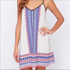 Lulu’s Catch a Glimpse cream and blue print dress
